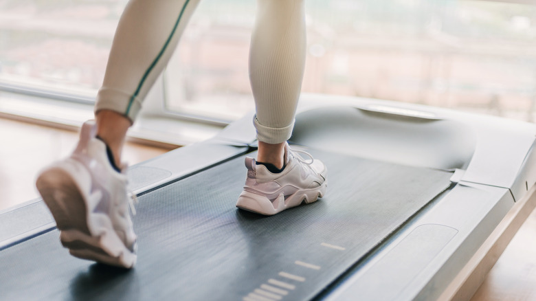 woman using desk treadmill