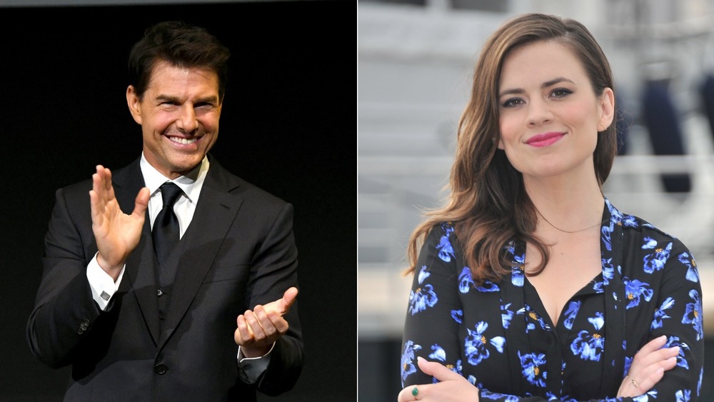 Tom Cruise waving and Hayley Atwell smiling