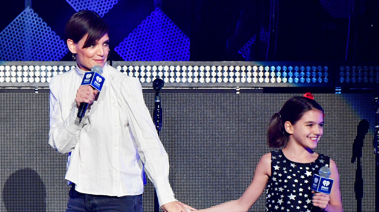 Katies Holmes and Suri on stage