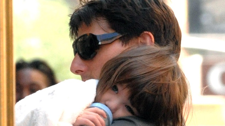 Tom Cruise holding baby Suri
