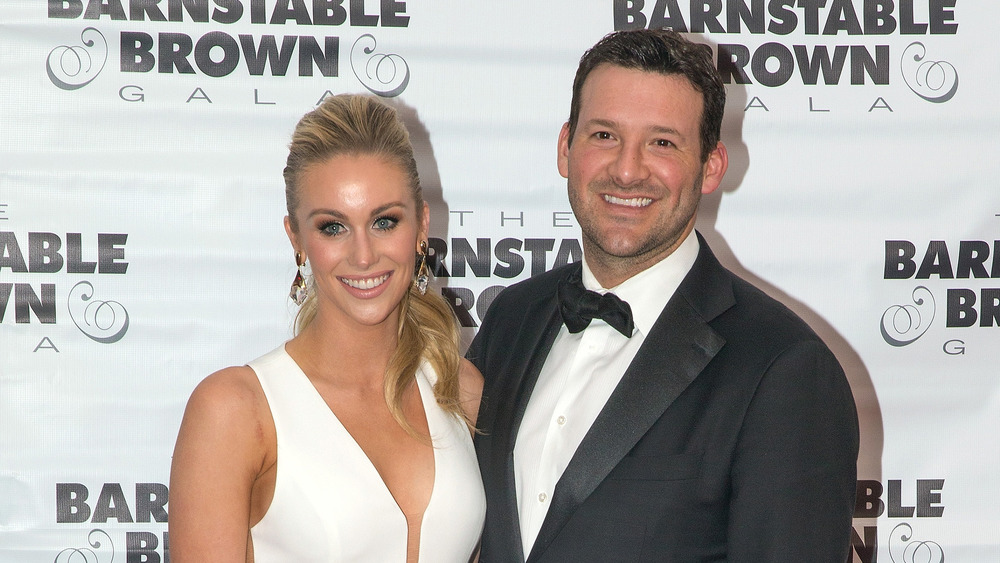 Tony Romo and his wife Candice Crawford pose together
