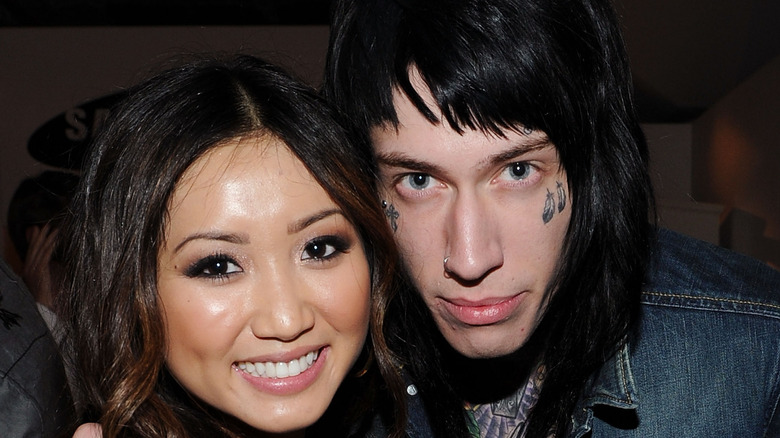 Brenda Song posing with Trace Cyrus