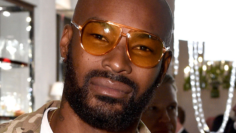 Tyson Beckford wears yellow sunglasses