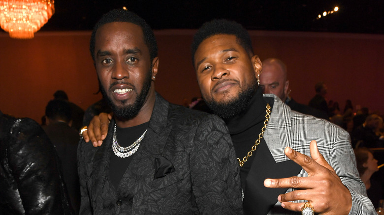 Diddy and Usher posing for photos
