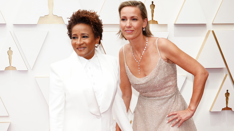 Wanda Sykes holding hands with her wife, Alex Niedbalski