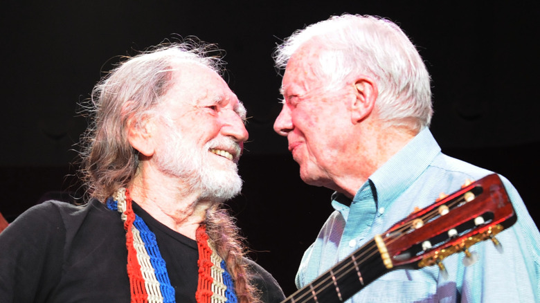 Willie Nelson and Jimmy Carter on stage