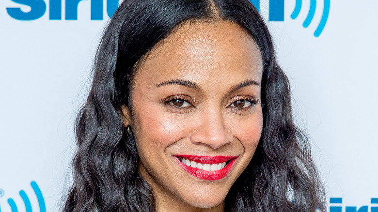 Zoe Saldana poses on the red carpet