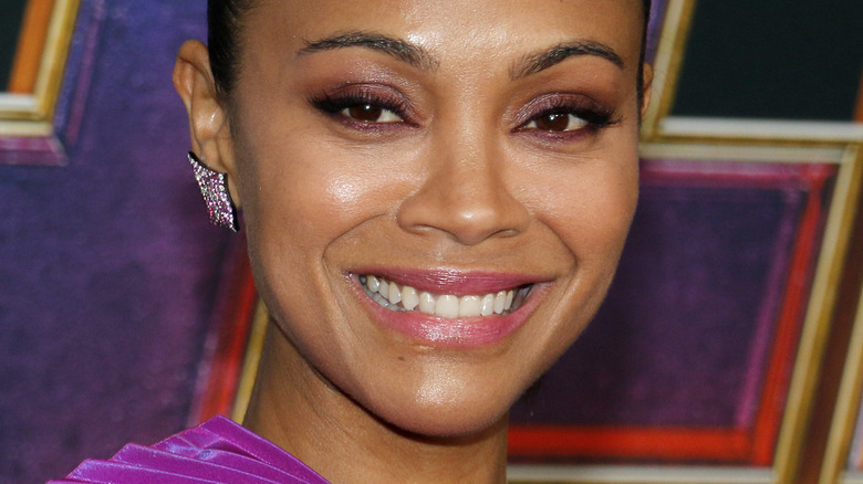 Zoe Saldana smiling at event