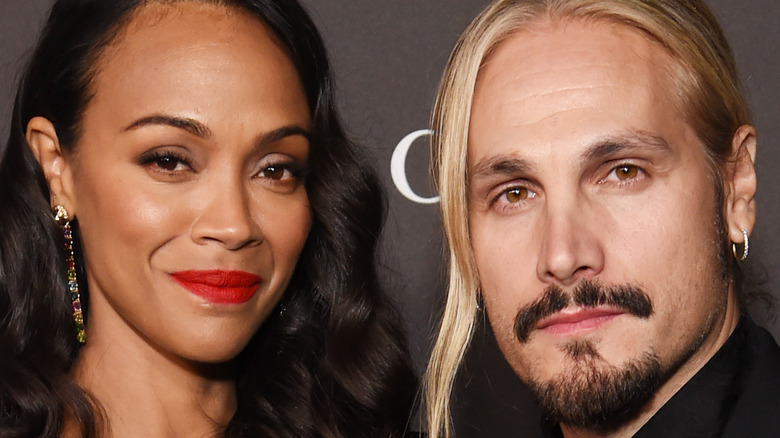 Zoe Saldana and Marco Perego posing together