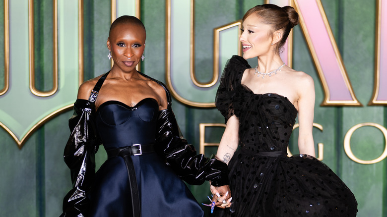 Cynthia Erivo and Ariana Grande holding hands