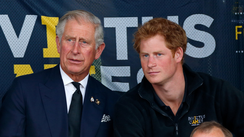 King Charles and prince harry looking at each other