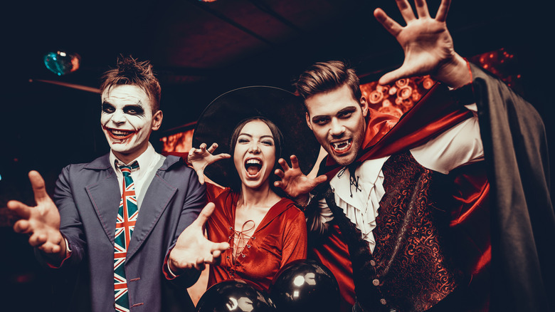 Group of young adults in Halloween costumes