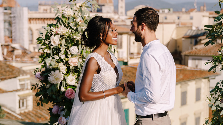 bride and groom smiling