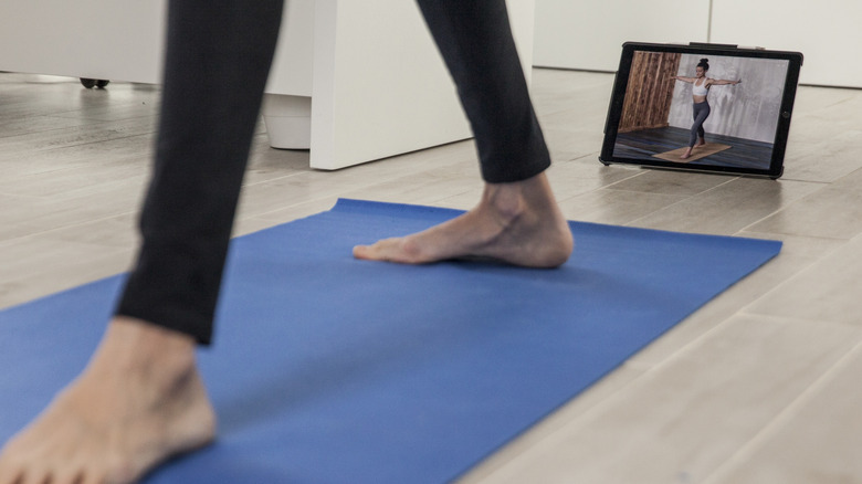 Woman following an online exercise class