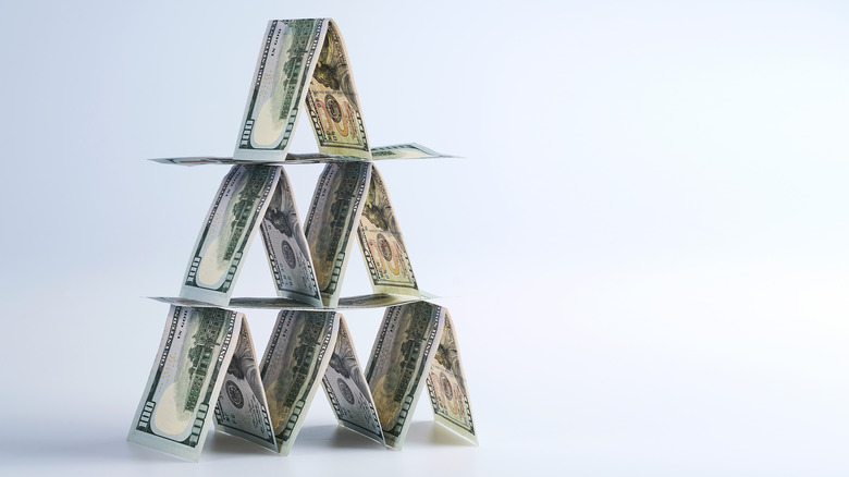 Money in the shape of a house of cards 