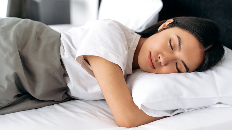 woman sleeping soundly in bed