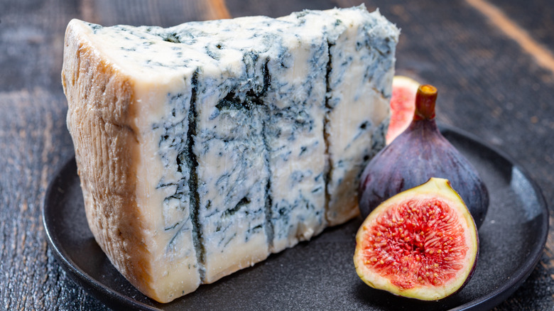 Large hunk of gorgonzola cheese with blue mold 