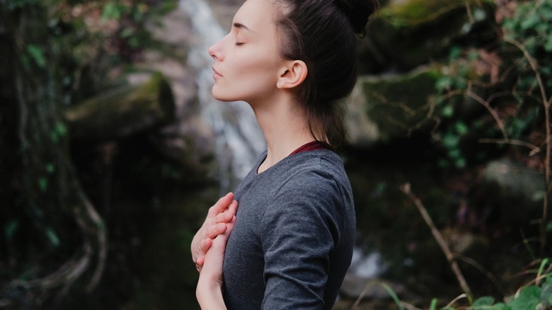 Woman in nature breathing deeply