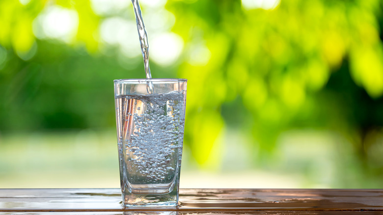 Pouring water into a glass 