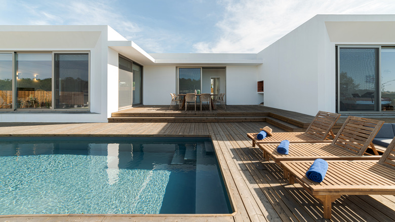 villa with backyard pool