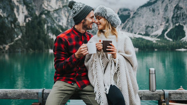 couple in love sharing coffee outside