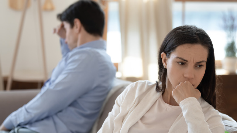 upset couple facing opposite directions