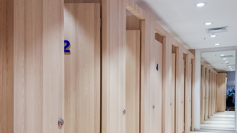 Line of dressing rooms in a store.