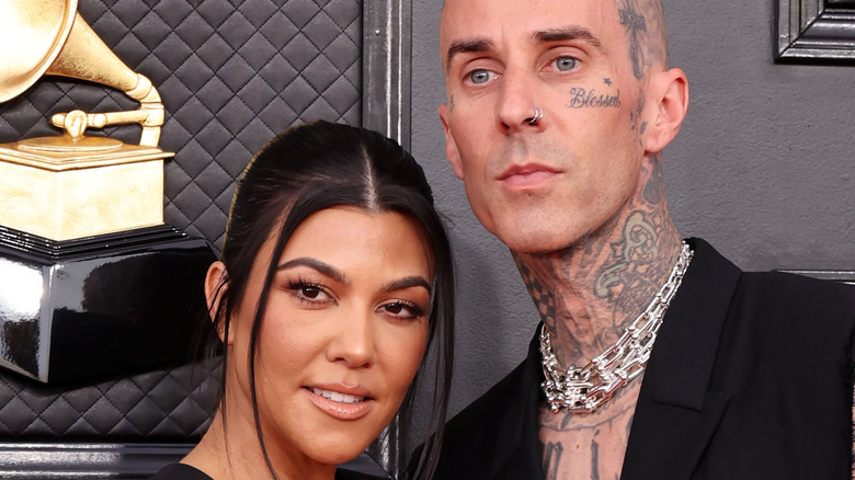 Kourtney Kardashian and Travis Barker on the red carpet. 