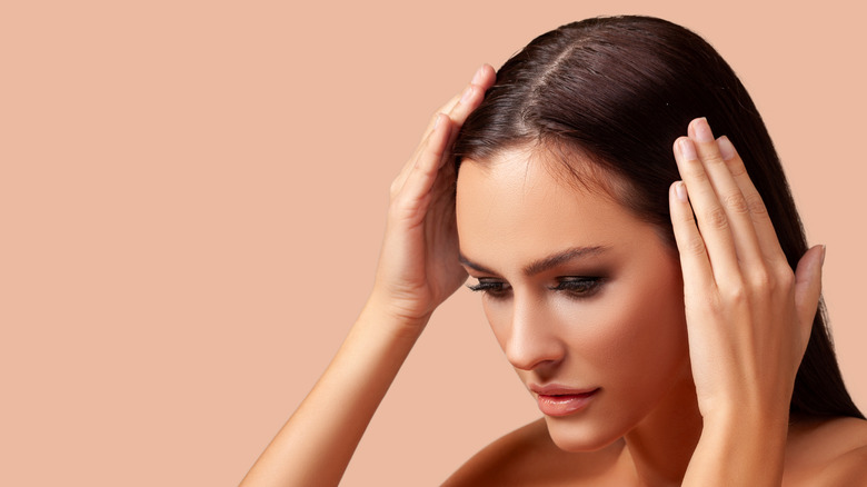 Woman touching her hair