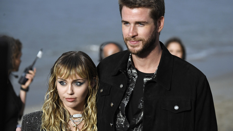 Miley Cyrus Liam Hemsworth posing