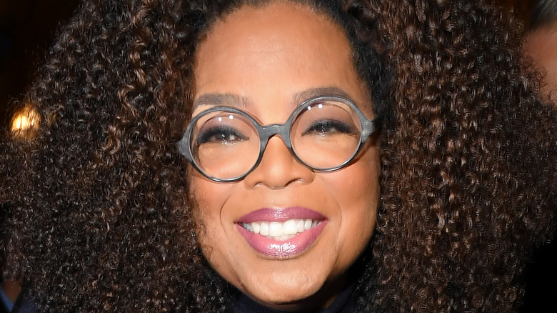 Oprah smiles at an event.