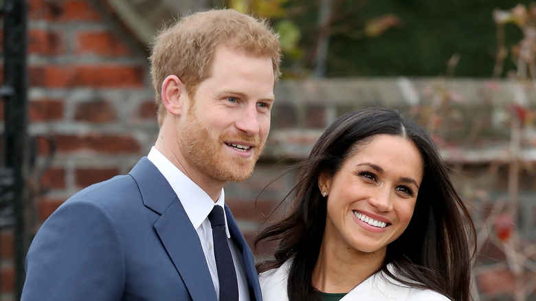 Prince Harry and Meghan Markle smile for a photograph