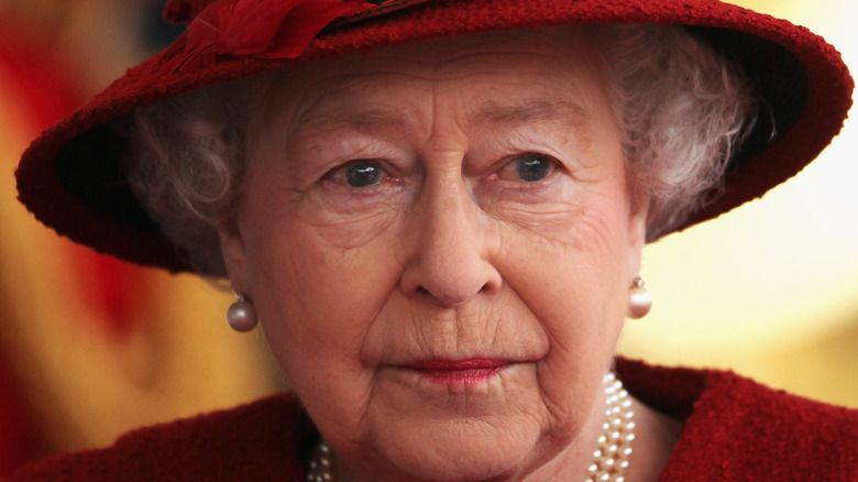 Queen Elizabeth in red hat
