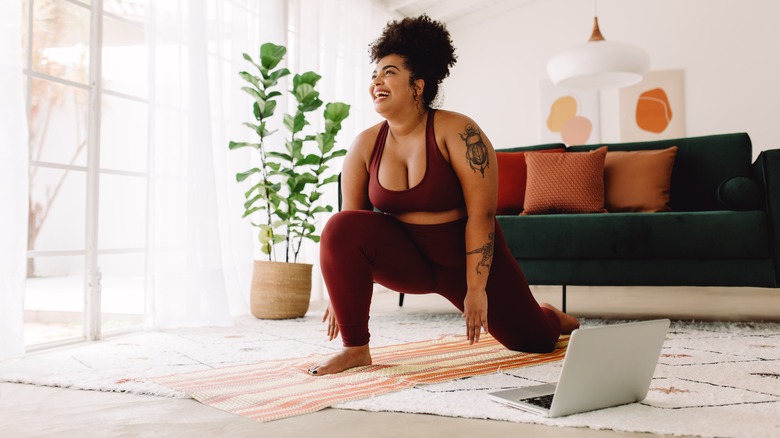 woman stretching at home