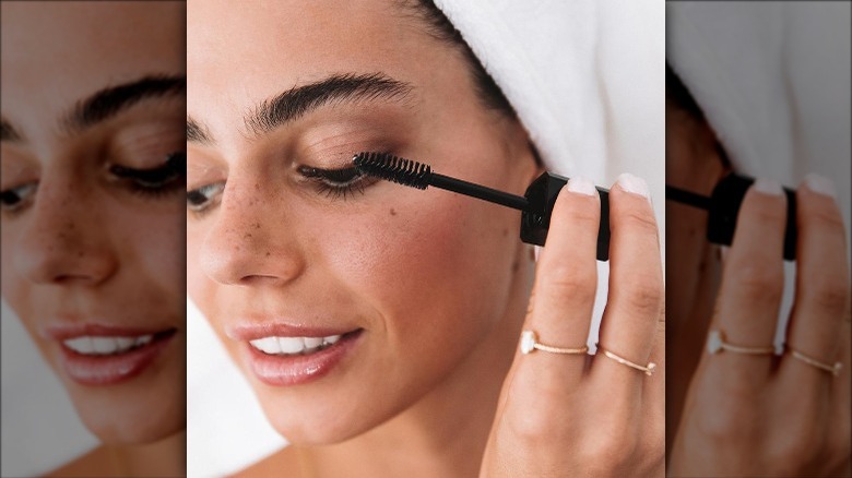 Woman applying Bondi Boost Lash Serum
