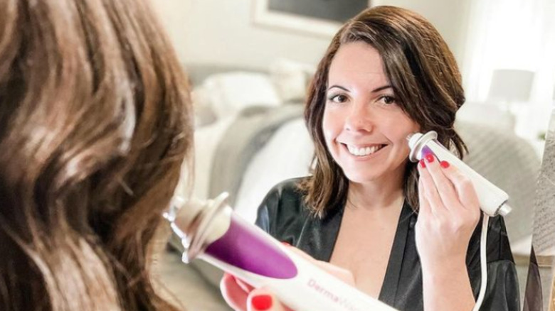 woman using a dermawand