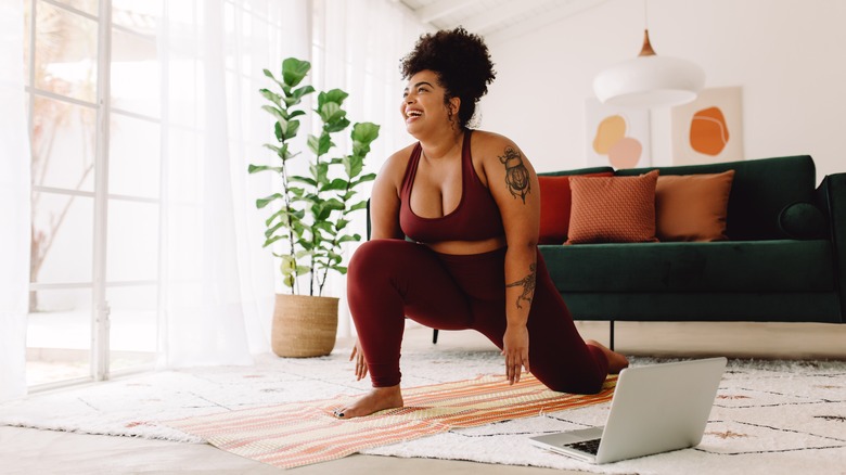 woman working out in living room