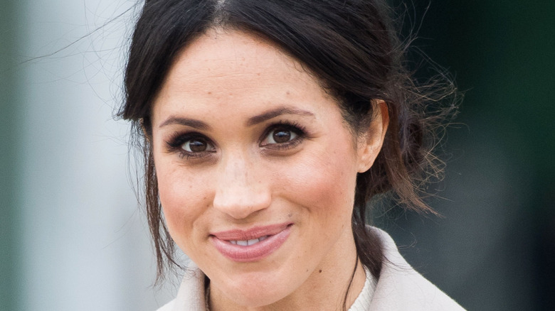 Meghan Markle smiles