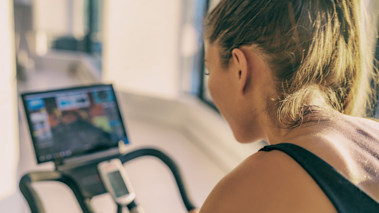 Woman doing Peloton workout