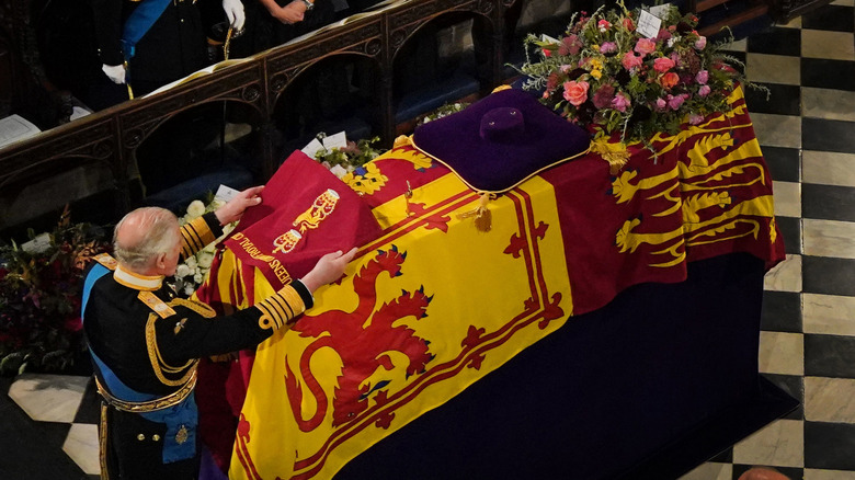 King Charles III with queen's coffin