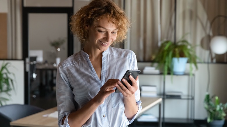 woman texting on phone