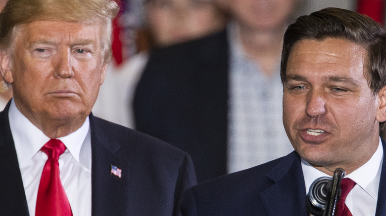 Ron DeSantis and Donald Trump at event