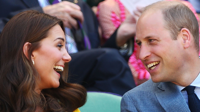 Kate Middleton and Prince William smile at each other.