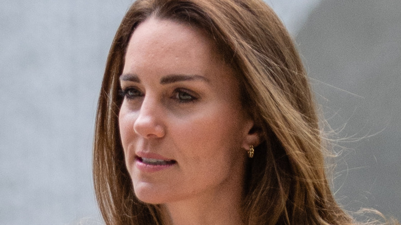 Kate Middleton looks stylish in jeans and a blazer.