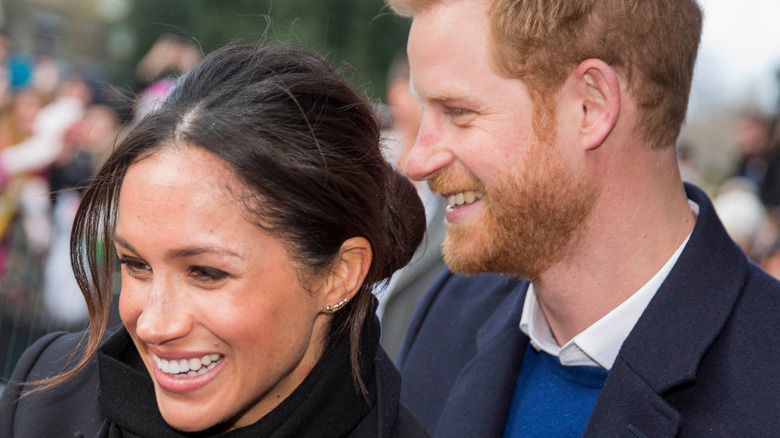 Harry and Meghan smiling