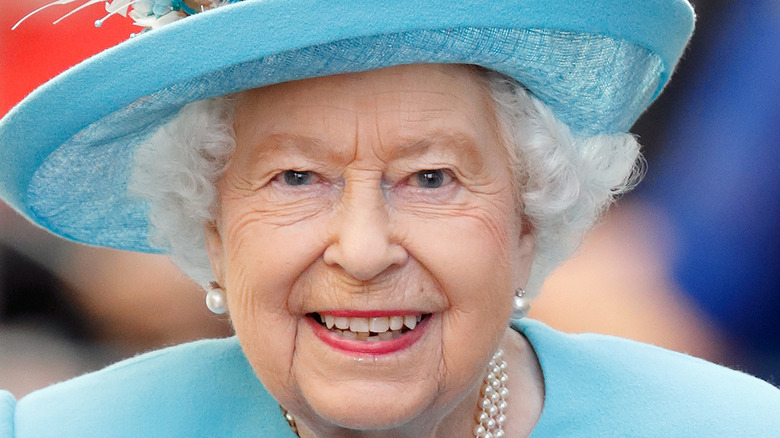 Queen Elizabeth II in blue hat