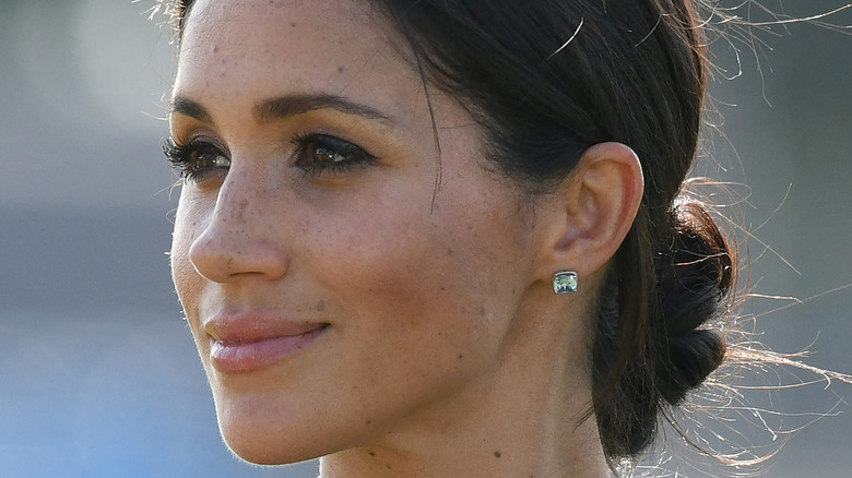 Meghan Markle wears her hair in a low bun