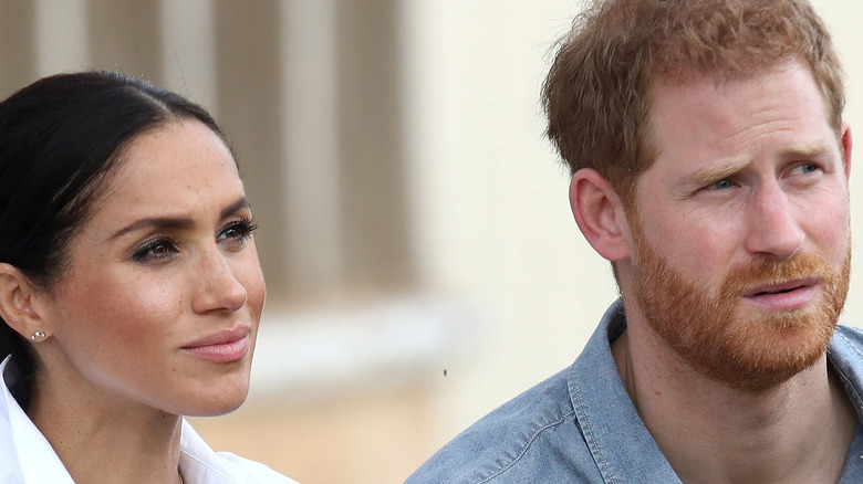 Prince Harry and Meghan Markle squinting