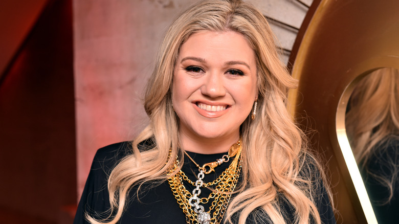 Kelly Clarkson smiles for the camera.
