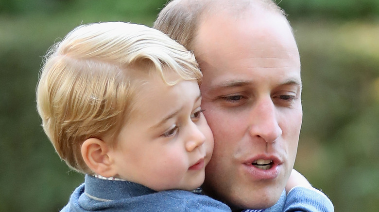 Prince George and Prince William at an event